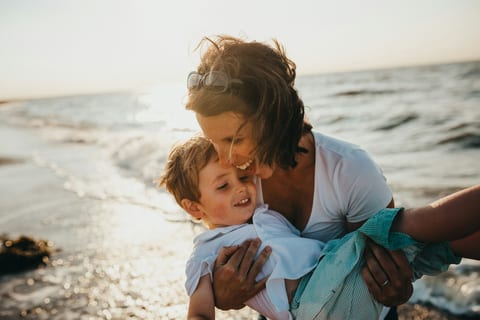 A mother hugging her son